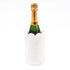 Bottle of champagne in a decorative holder on a white background