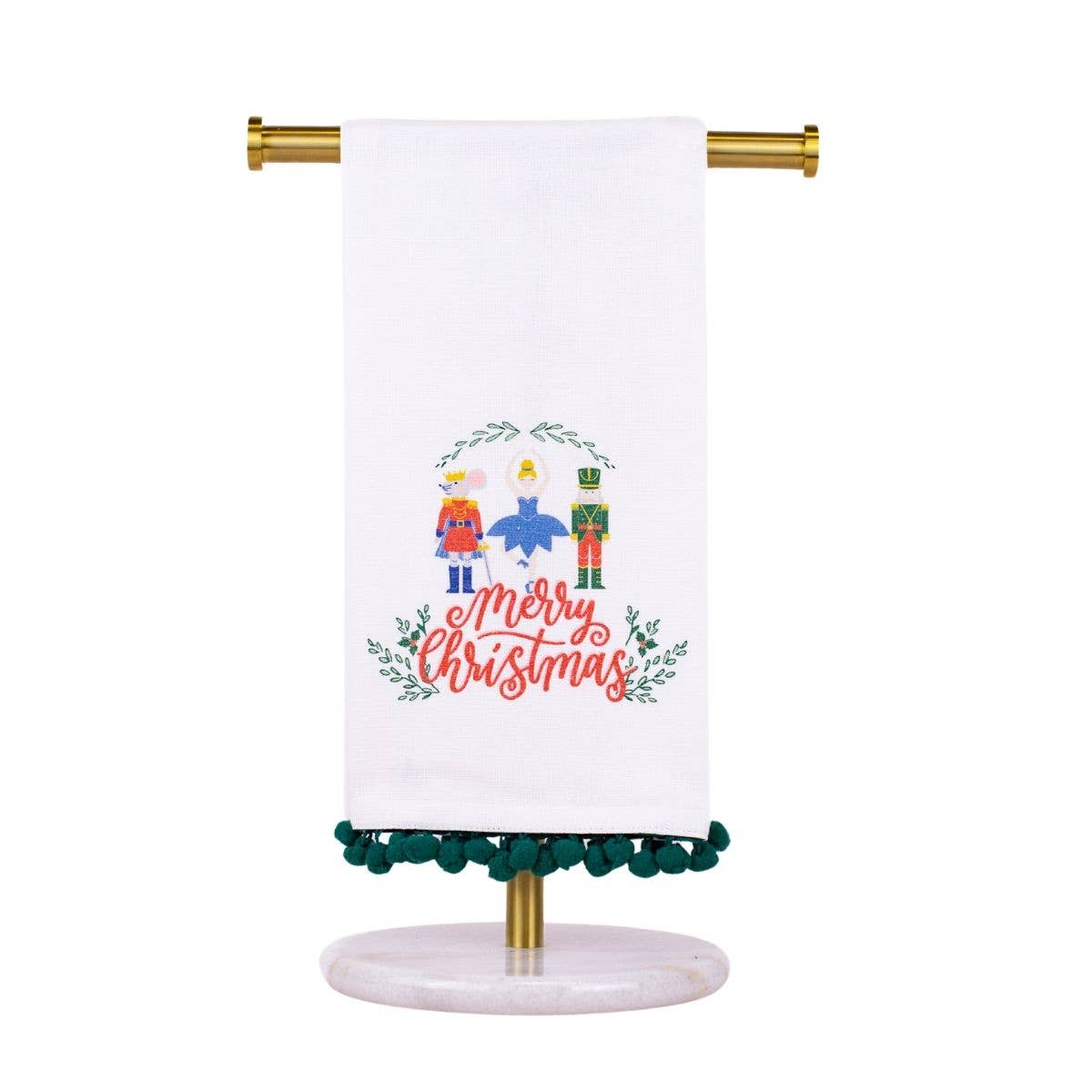 Decorative towel with Christmas design on a stand against a white background