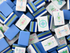 Close-up of a pile of blue and white Mahjong tiles.
