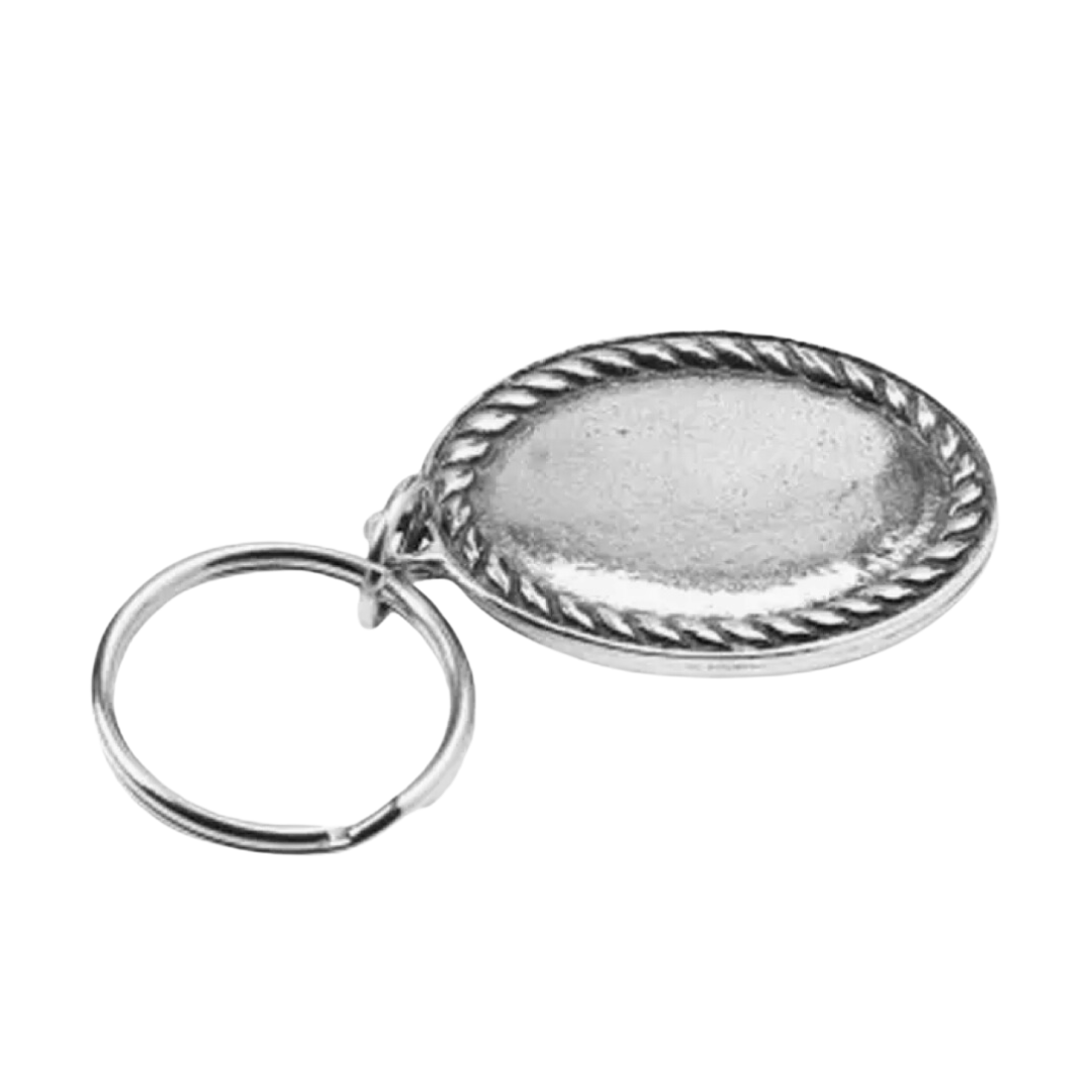 A cast pewter key ring with a rope edge design.
