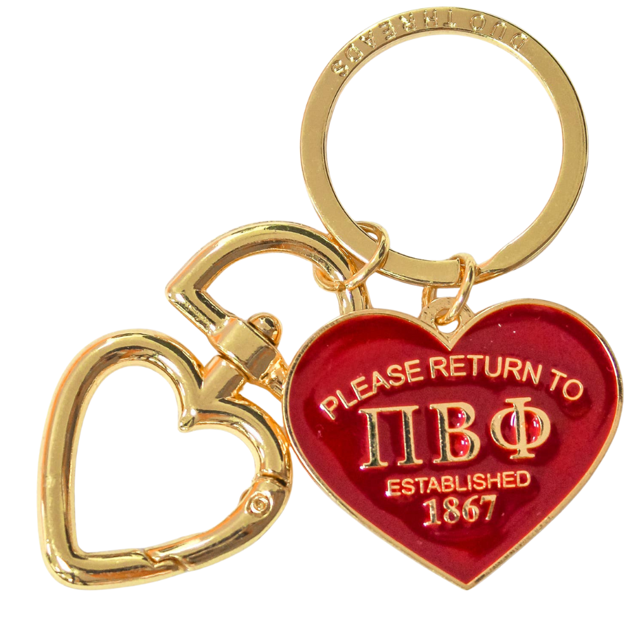 Keychain with red heart-shaped tag and gold heart-shaped tag on a white background