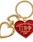 Keychain with red heart-shaped tag and gold heart-shaped tag on a white background