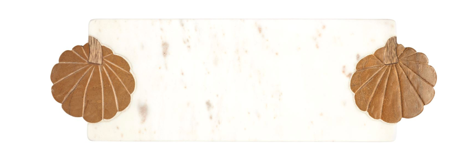 Two wooden pumpkins attached to a long, narrow white marble board, shown against a plain white background.
