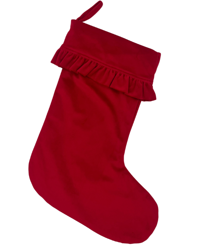 Large red velvet stocking on a white background