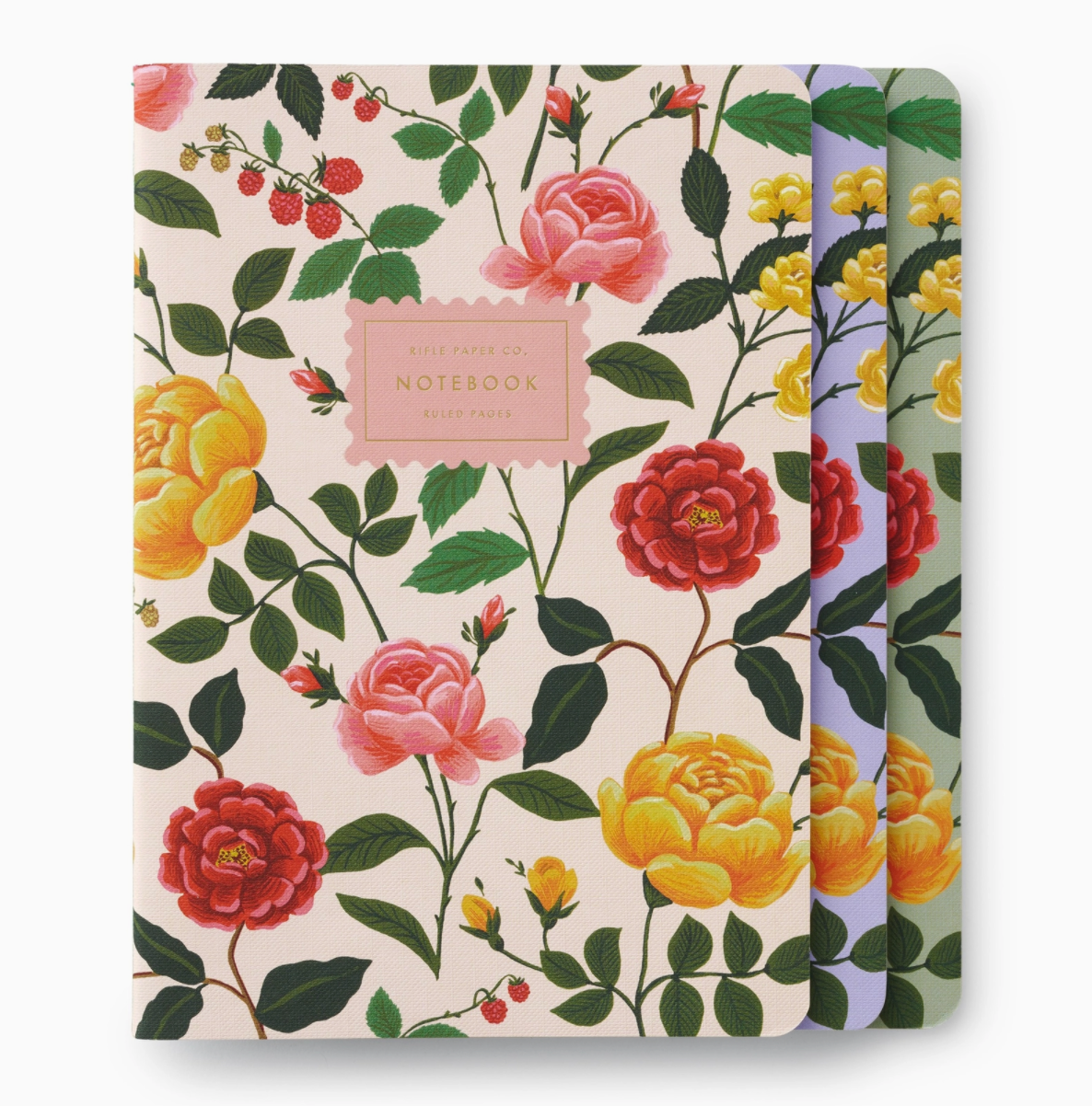 A set of three notebooks with floral patterns and gold foil accents on the covers.