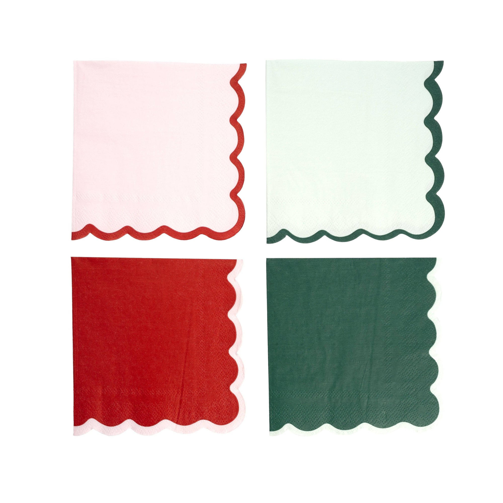 Four square paper napkins with scalloped edges arranged in a 2x2 grid on a white background. The top-left napkin is light pink with a red scalloped edge, the top-right is off-white with a dark green scalloped edge, the bottom-left is red with a white scalloped edge, and the bottom-right is dark green.