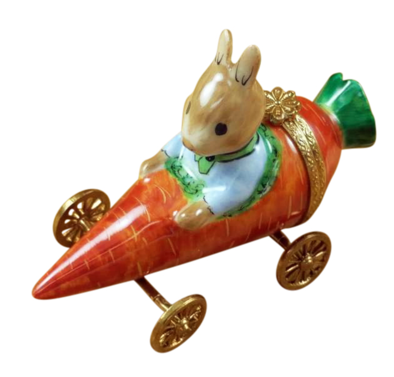Decorative figurine of a rabbit in a carrot-shaped car with gold wheels on a white background