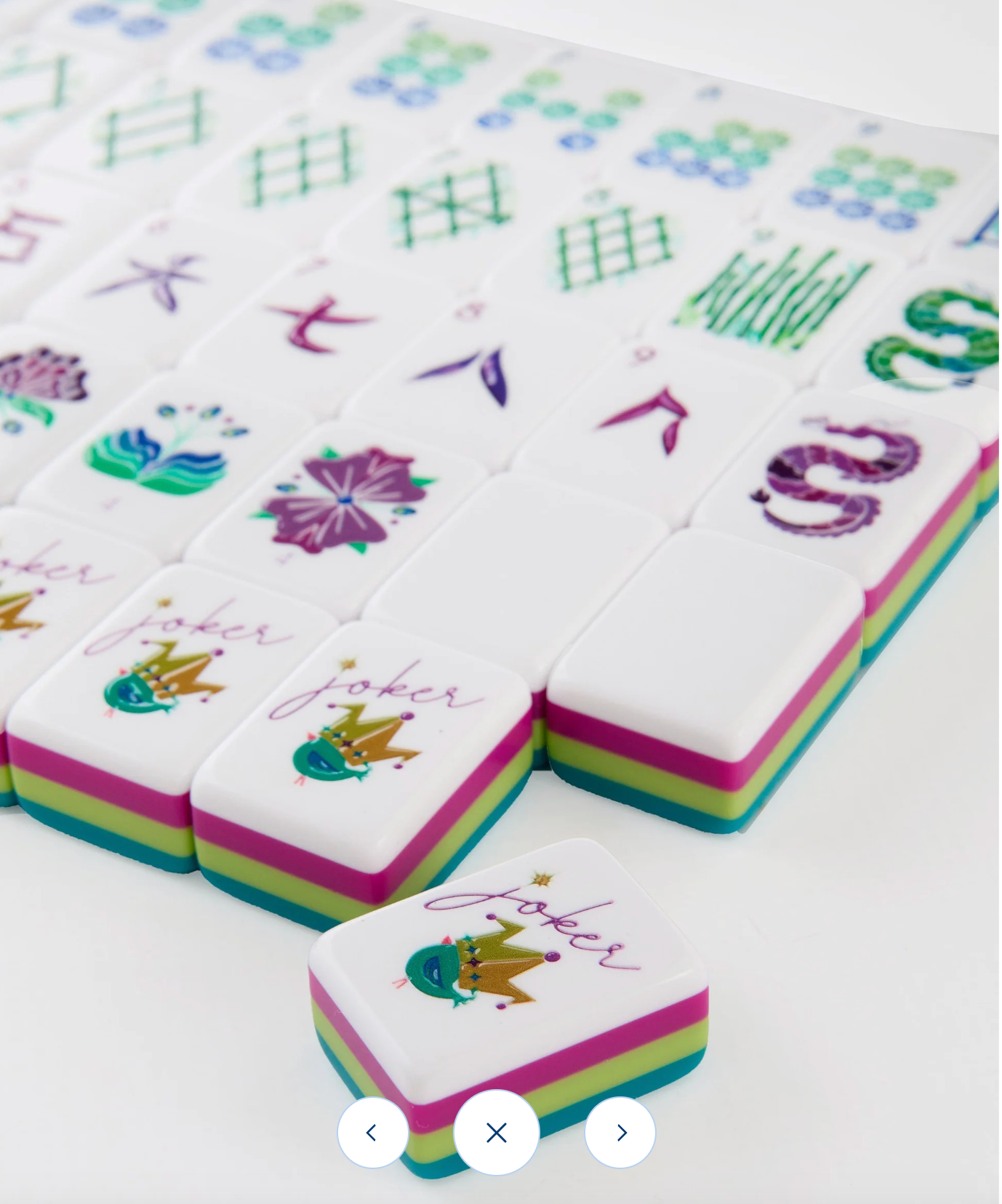 Colorful Mahjong tiles with various symbols on a white background