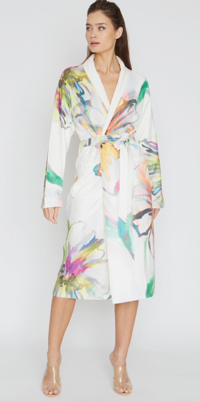 Woman wearing a colorful robe on a white background