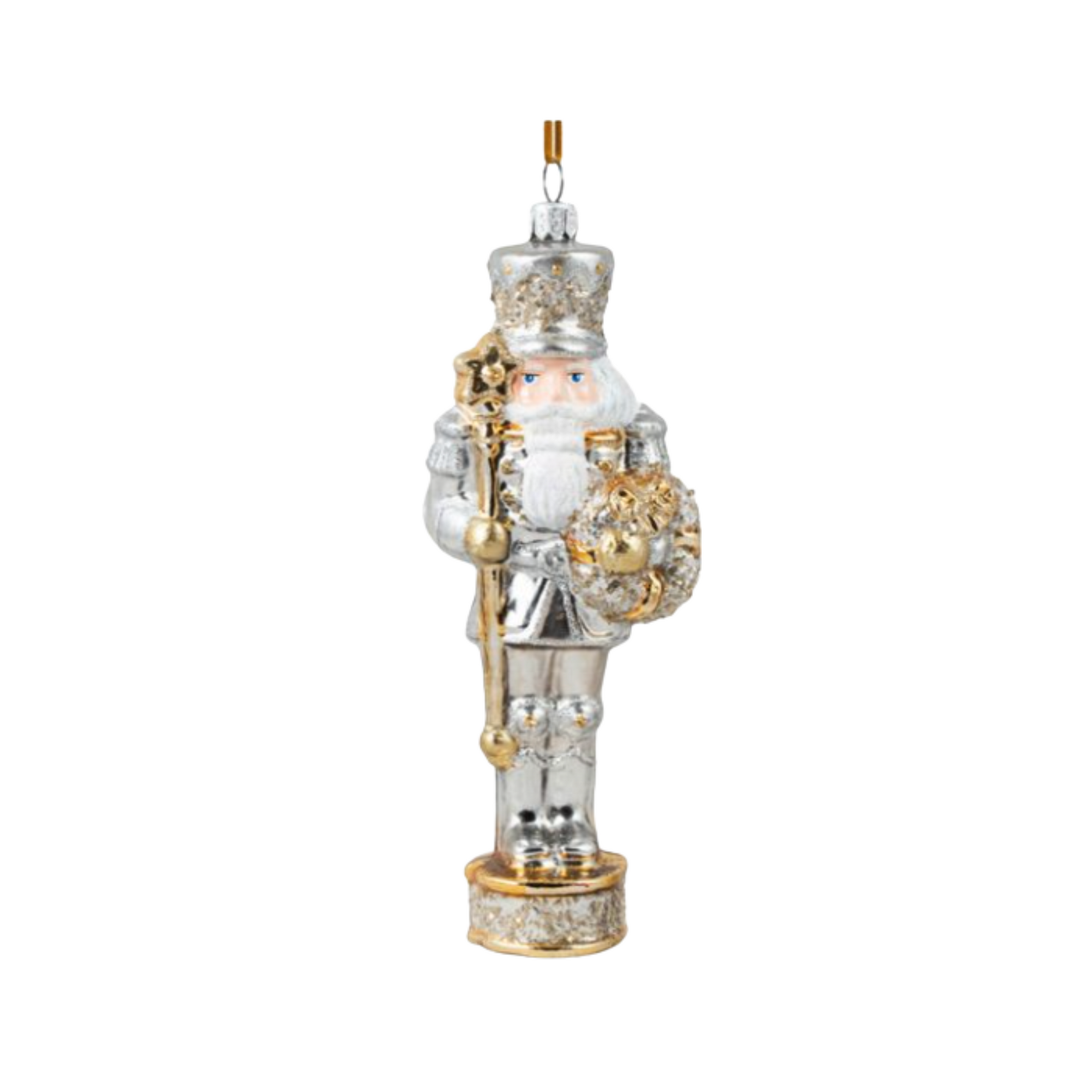 Decorative nutcracker ornament with silver and gold accents on a white background