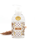 Foaming hand soap bottle with decorative label on a white background