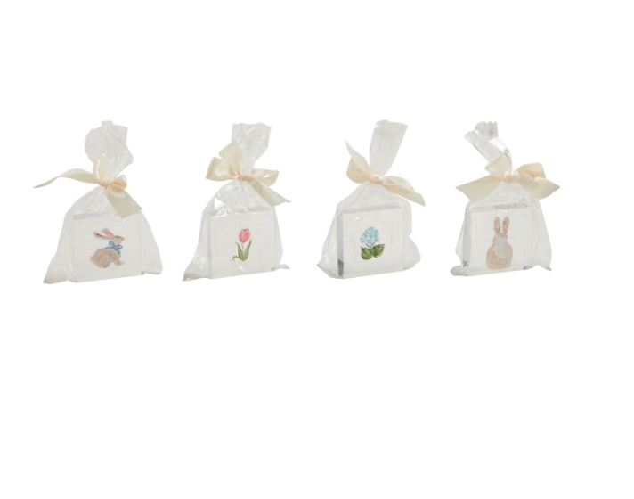 A set of five clear acrylic decorative blocks, each with a different spring-themed design, tied with white ribbons.