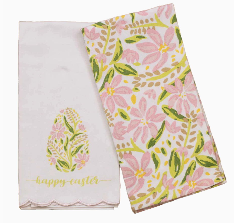 Two hand towels, one with a solid white background and the other with a white/multicolor floral pattern, including the text 'happy easter'.