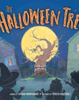 Illustrated children's book cover for "The Halloween Tree" showing a spooky tree with a face in a neighborhood at night, with silhouettes of children and a witch hat in the foreground.