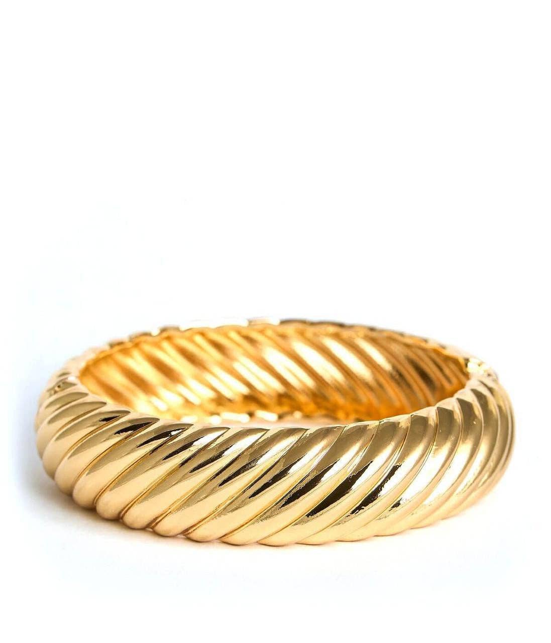 Gold bracelet on a white background