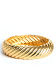 Gold bracelet on a white background
