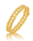 Gold bracelet with intricate design on a white background
