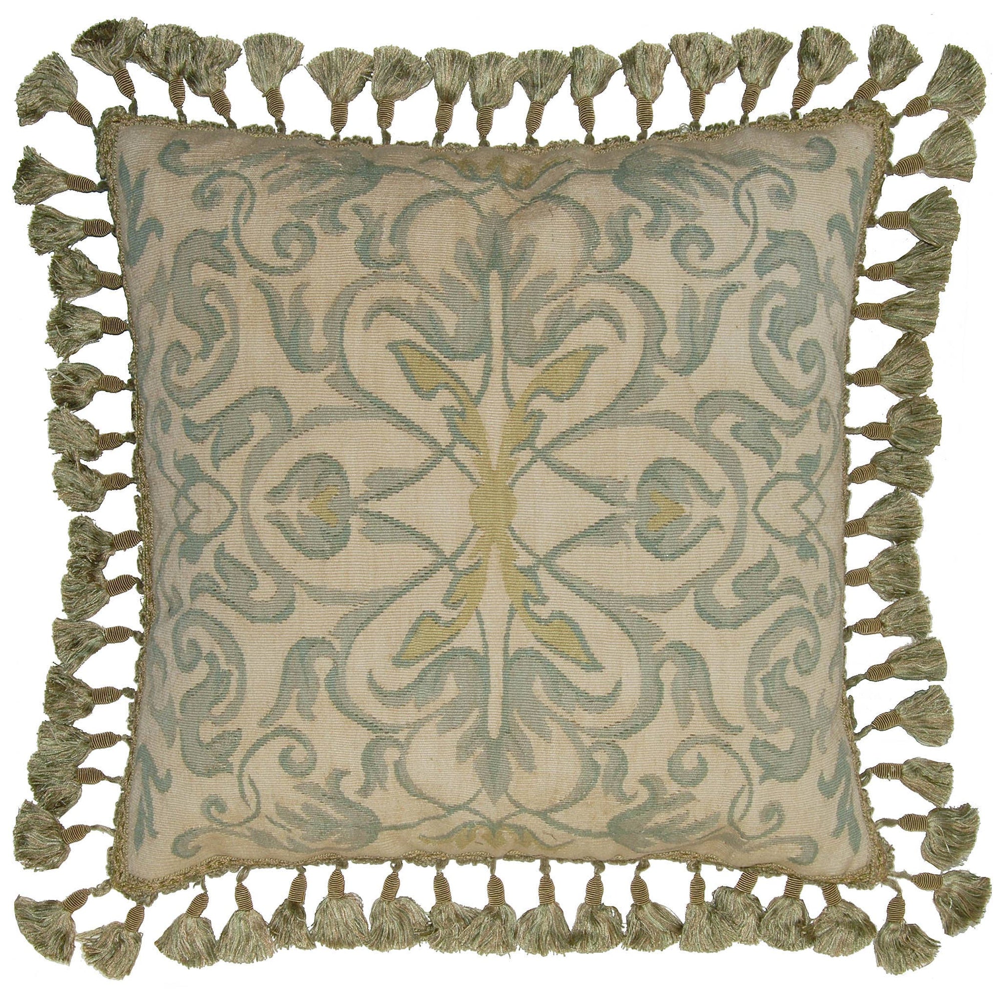 A square decorative throw pillow with a beige base and an intricate damask-style pattern in muted sage green and olive yellow, finished with a border of knotted tassels on all sides.