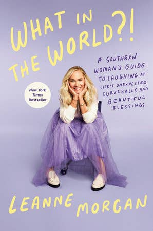 Book cover of 'What in the World?!' by Leanne Morgan with a woman in a purple dress on a purple background.