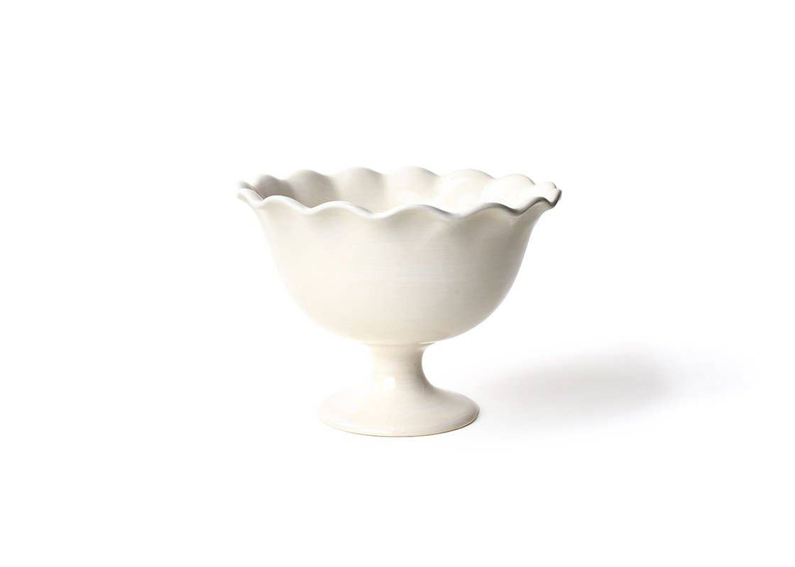 A white, ruffled trifle bowl with a footed base, suitable for serving desserts or as a decorative piece.