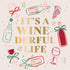 Decorative design napkin with wine bottles, glasses, and grapes on a light background with text 'It's a wine-derful life'.