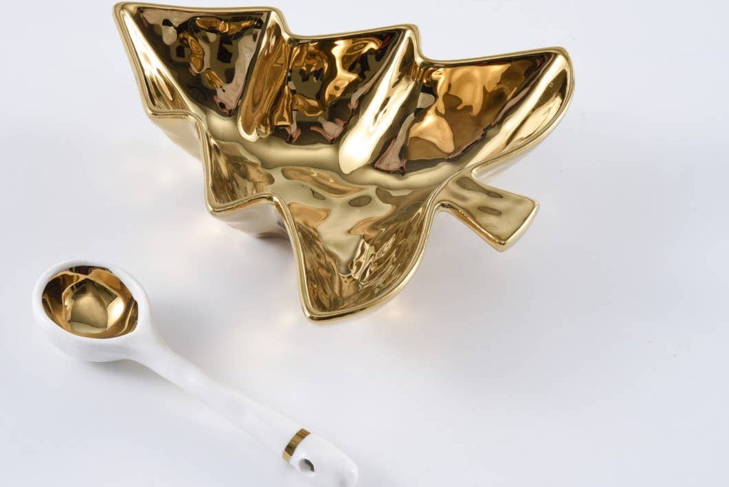 Gold serving bowl shaped like a Christmas tree on a white background