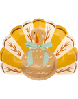 Turkey-shaped paper plates with a bow on a white background
