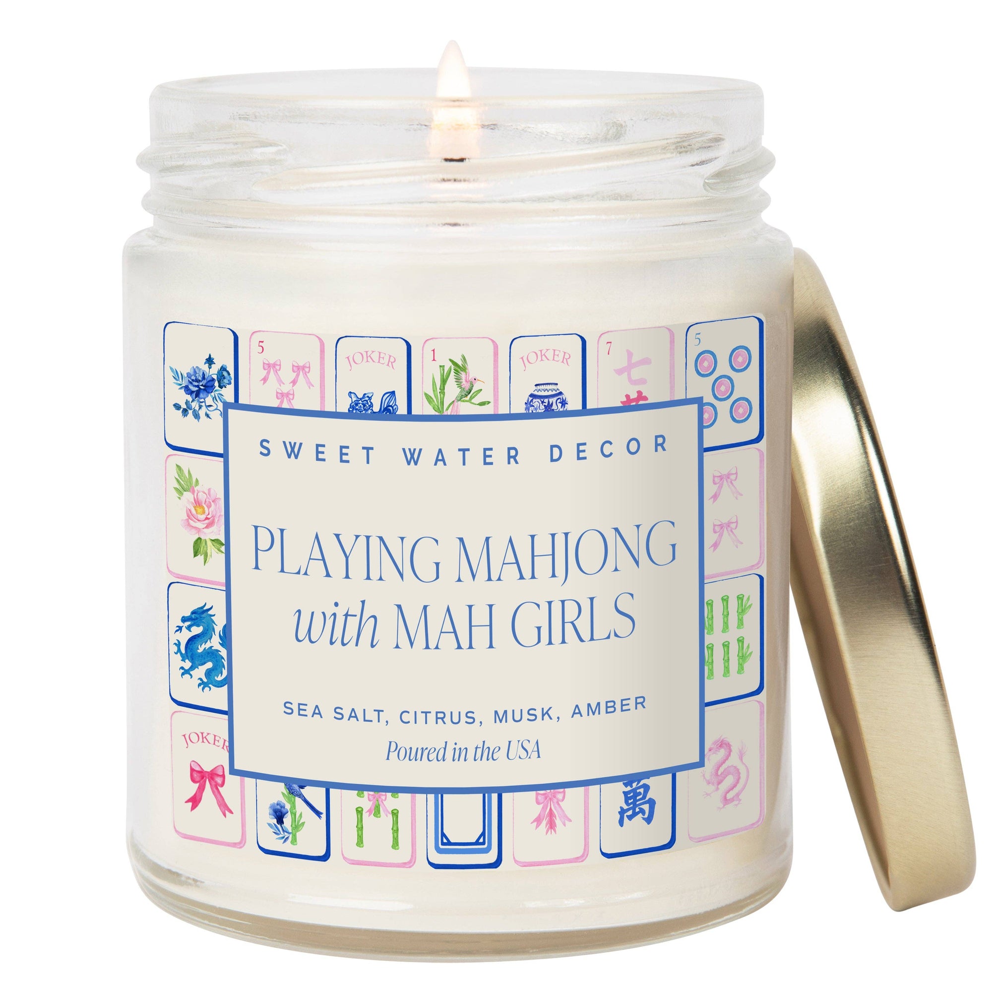 Candle in a jar with a decorative label featuring Mahjong design and brand name 'Sweet Water Decor'.