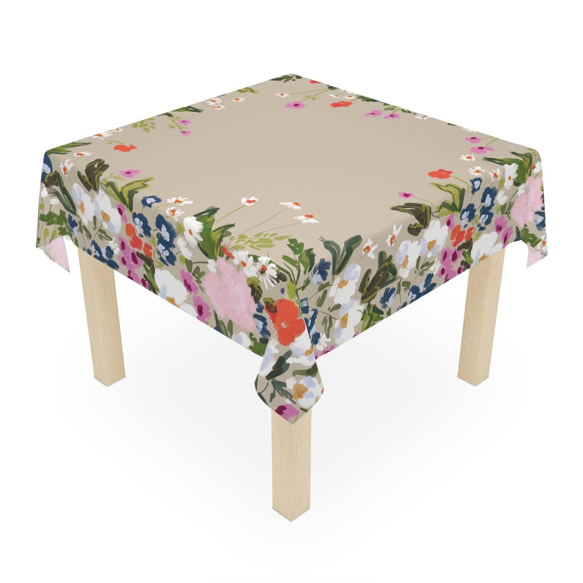 Floral tablecloth on a wooden table with a white background
