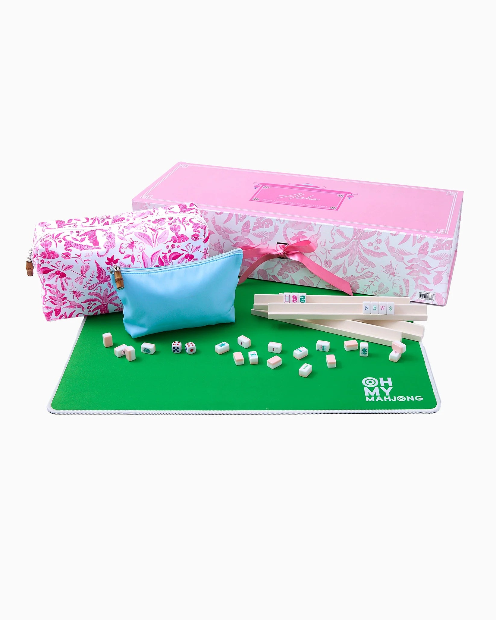 Mahjong set with pink box, green mat, dice, and tiles on a white background