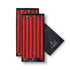 A set of red unscented taper candles presented in a black box with the brand name 'Colonial Candle' visible on the packaging.