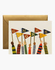 Greeting card with colorful flags and 'Congrats' text, featuring a brown envelope on a white background.