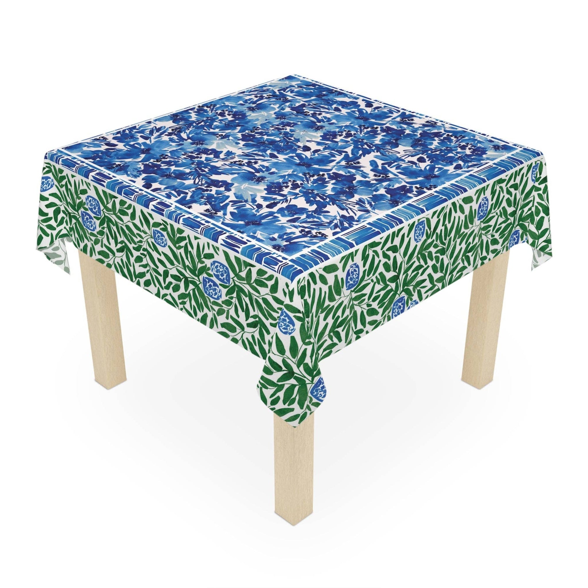 Table with a floral patterned tablecloth on a white background