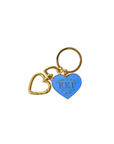Gold and blue keychain with heart-shaped tag on a white background