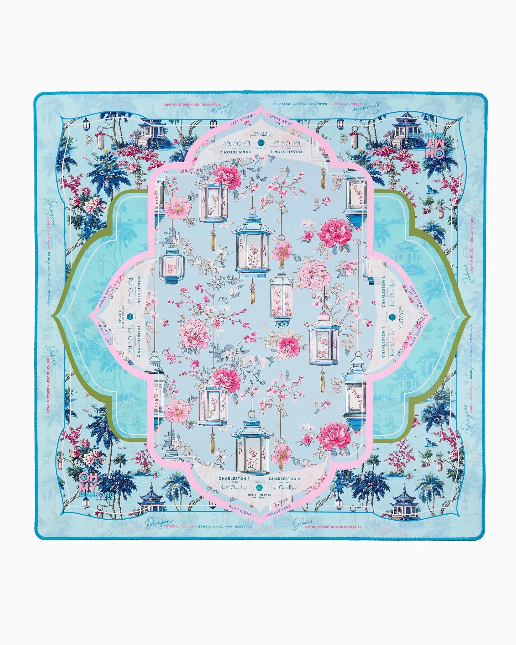 Decorative mahjong mat with floral and architectural design on a blue background