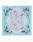 Decorative mahjong mat with floral and architectural design on a blue background