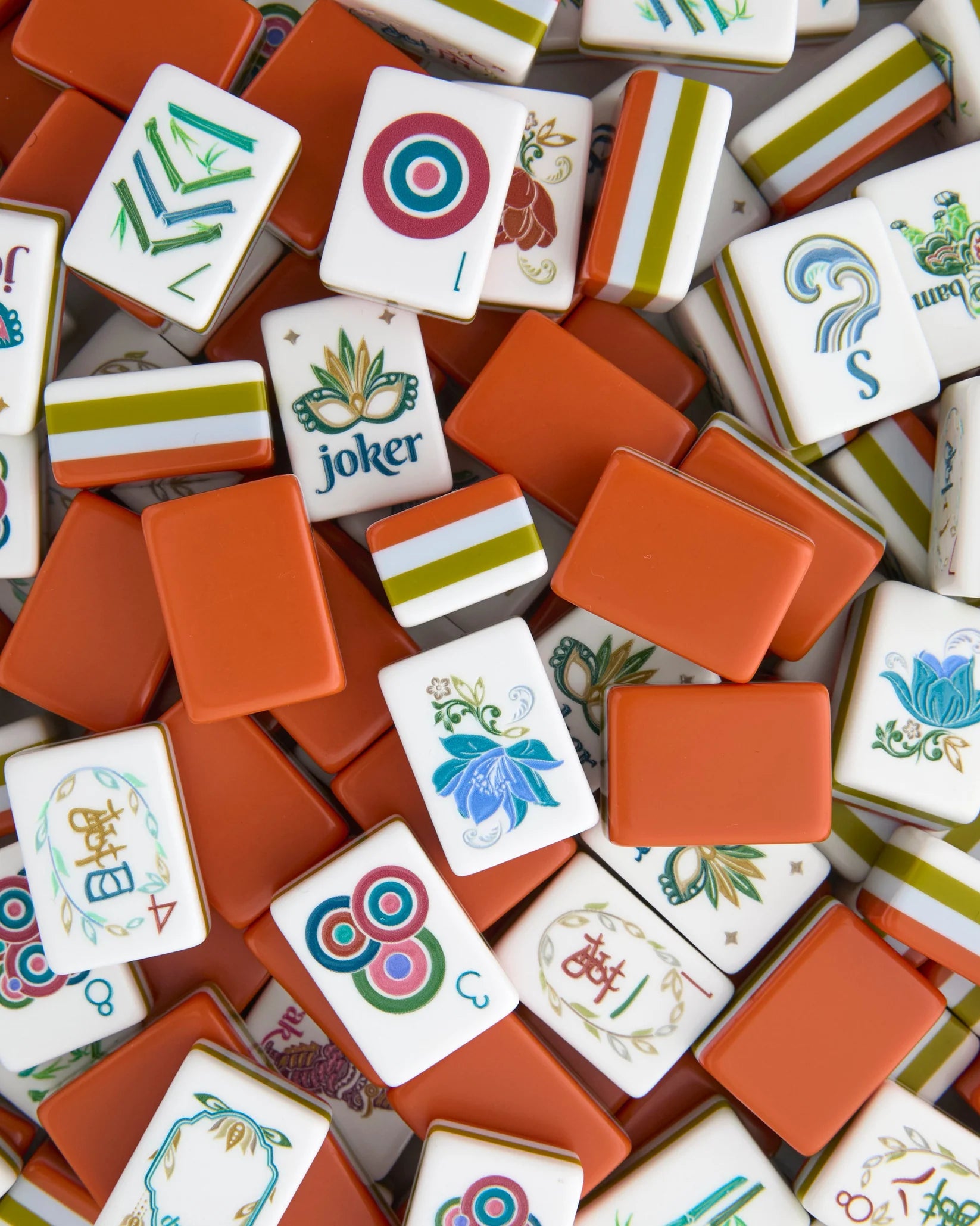 Collection of colorful Mahjong tiles with various symbols and designs.